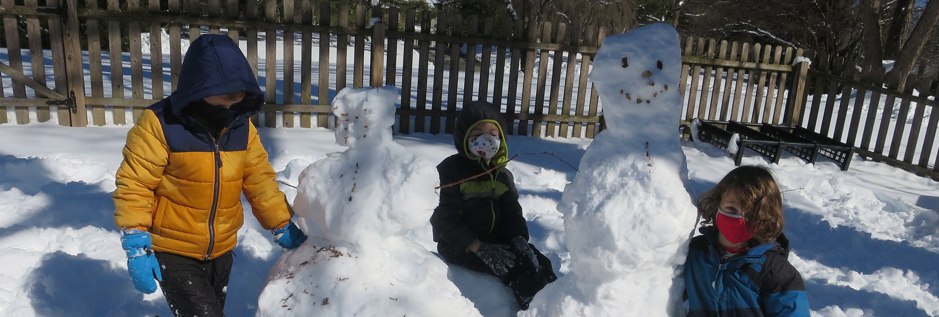 children building snowmen